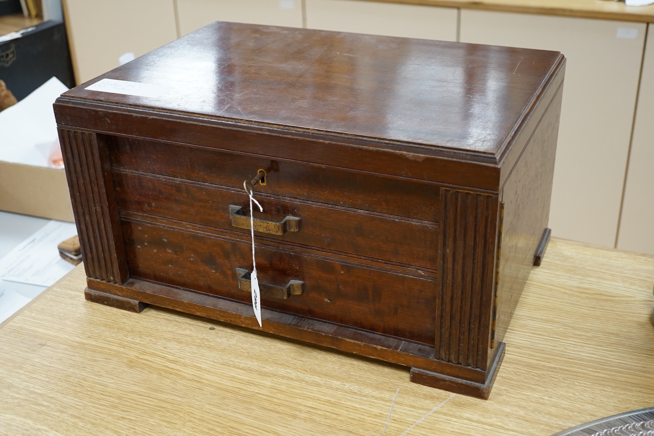 A mahogany case of plated cutlery and part set of mother of pearl handled dessert knives and forks, largest 46cm wide